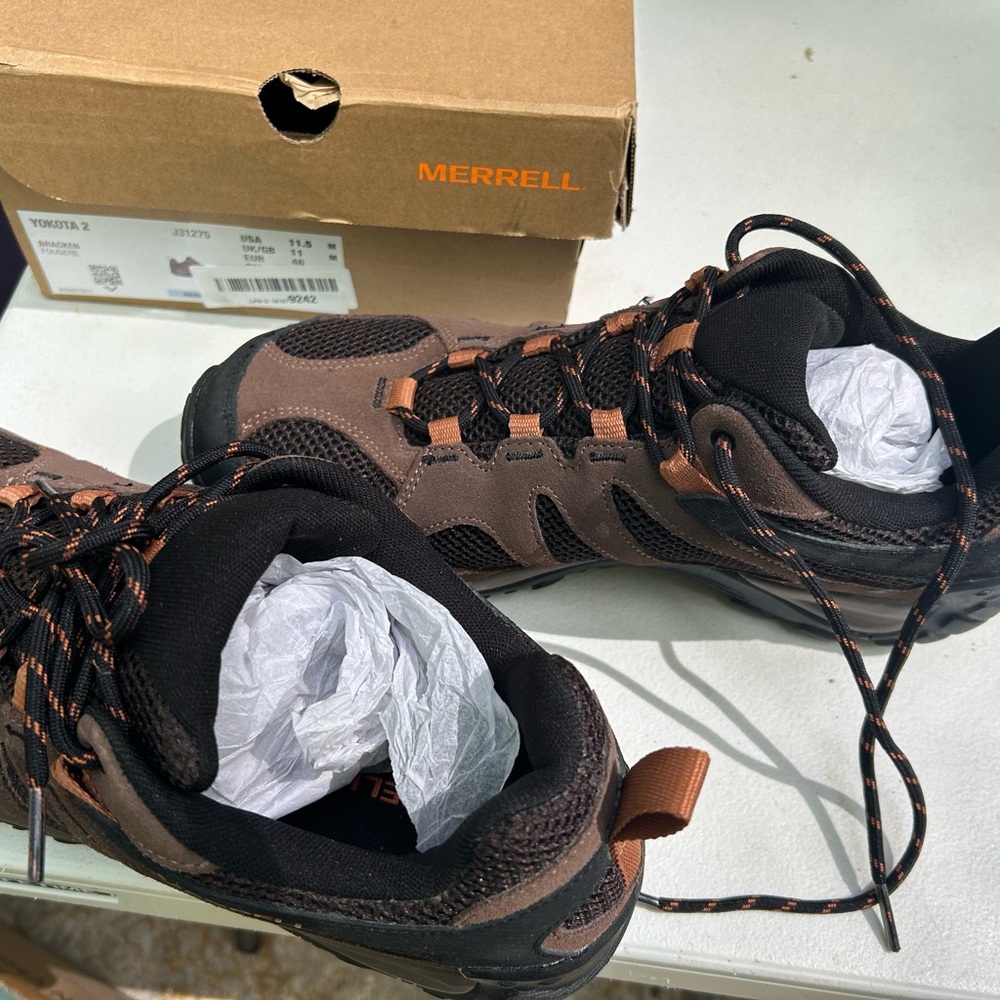 Merrell Brown and Black shoes with lace up closure